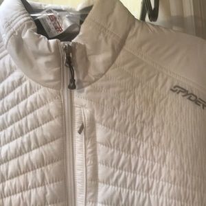 Woman’s white spyder jacket.